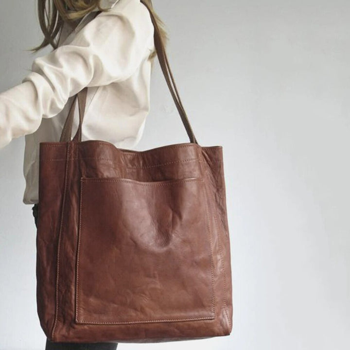 https://cdn.shopify.com/s/files/1/0750/0519/8393/files/AX0YVrouwen-Zachte-Pu-Lederen-Schoudertas-Toevallige-Vintage-Grote-Handtassen-Mode-Nieuwe-Eenvoudige-Onderarm-Tassen-Luxe-Designer.jpg?v=1758575477