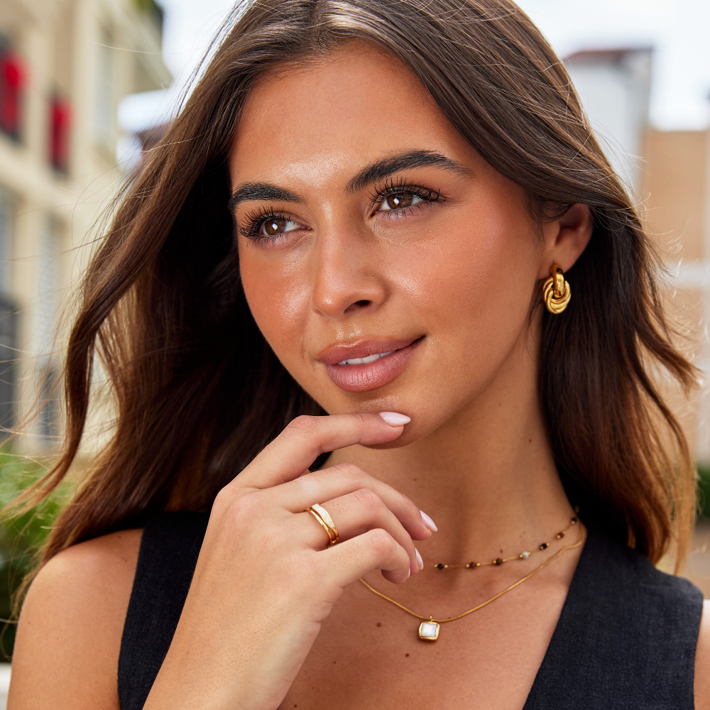 https://cdn.shopify.com/s/files/1/0750/0519/8393/files/SofiaTwistedGoldHoopEarrings_LayeredSaharaGoldRing_f4c77e2d-760f-4438-a68b-36dbb8754eb9.png?v=1758576303